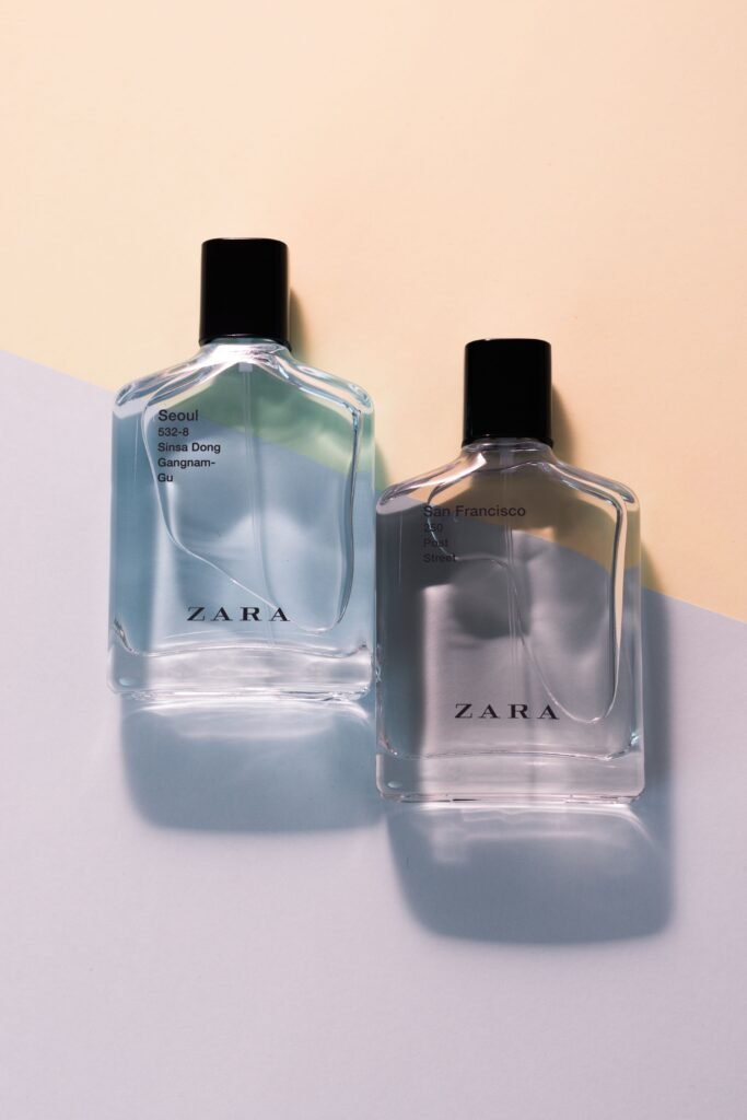 Stylish Zara perfume bottles on a minimalist pastel backdrop, perfect for showcasing fragrance elegance.